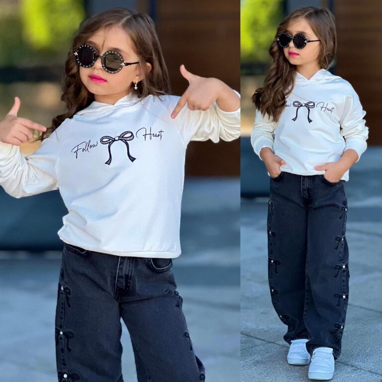 Biała bluza z napisem "Follow Heart" oraz czarne jeansy dla dziewczynki, idealny strój na codzienne wyjścia