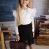 Czarna spódnica bawełniana z tiulem, idealna dla dziewczynki, zestawiona z białą bluzką z falbanami. Czarna spódnica bawełniana z tiulem, idealna dla dziewczynki, zestawiona z białą bluzką z falbanami.