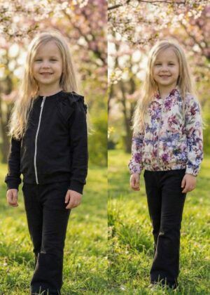 Zestaw dwóch bluz z długimi rękawami i spodniami dla dziewczynki, w tym czarna bluza z falbankami oraz kolorowa bluza w kwiaty.